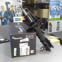 Амортизатор передний левый газо-масляный (пр-во MANDO) CHEVROLET AVEO T200, T250